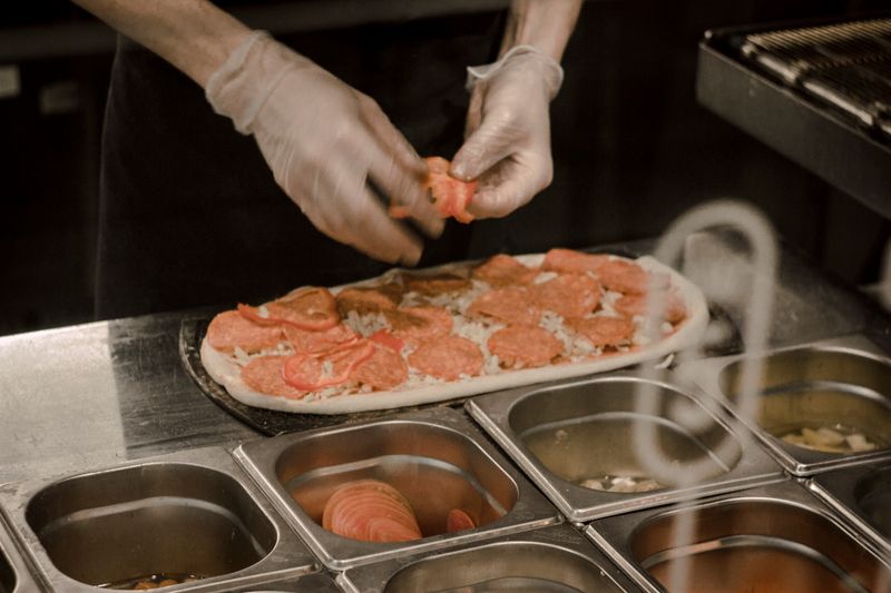 Green Lantern Pizza kitchen — fresh pizza being made
